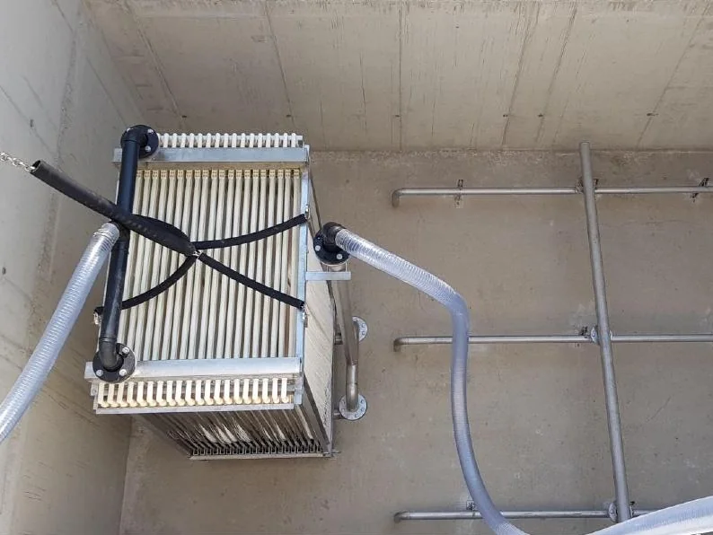 Photo: Rotreat MBR membrane module in a concrete tank, with air and permeate lines