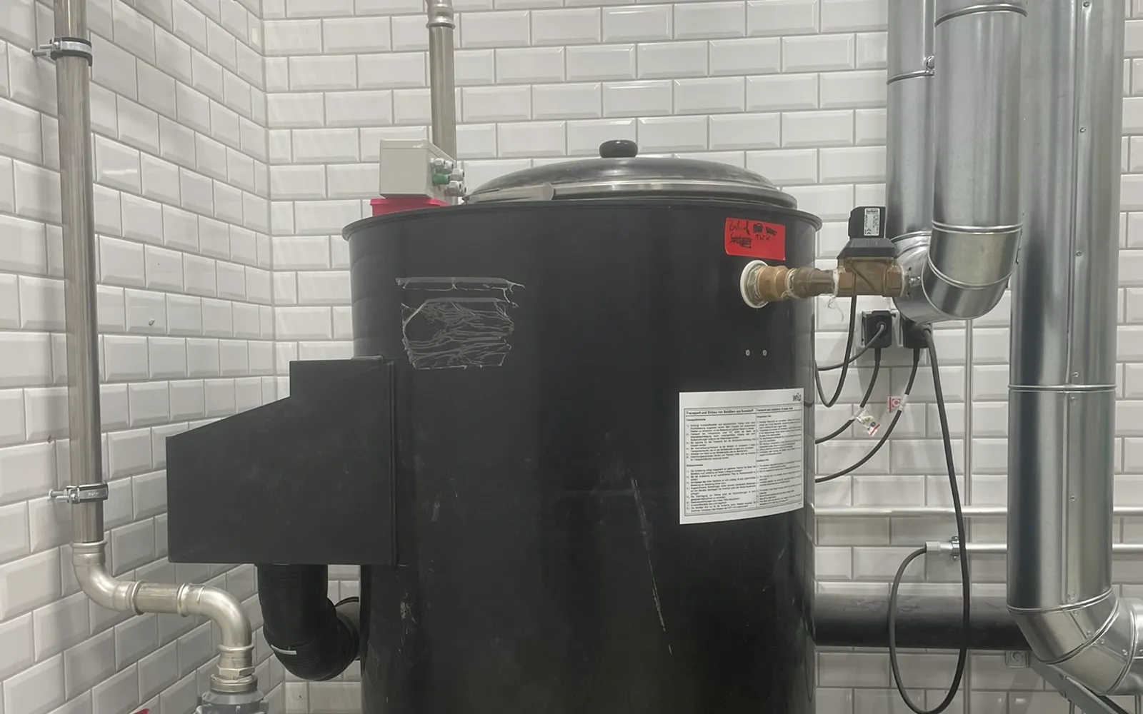 Installed treatment vessel with connected pipework